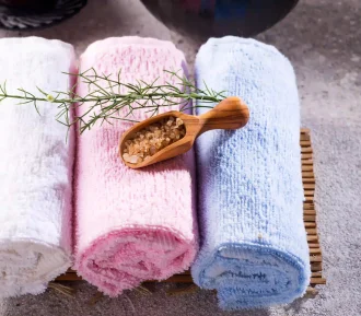 color-towels-with-green-leaves-and-a-spoon-of-salt-2025-01-08-15-20-03-utc